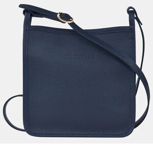 In Search of Le Foulonné small zipped crossbody in navy blue color.